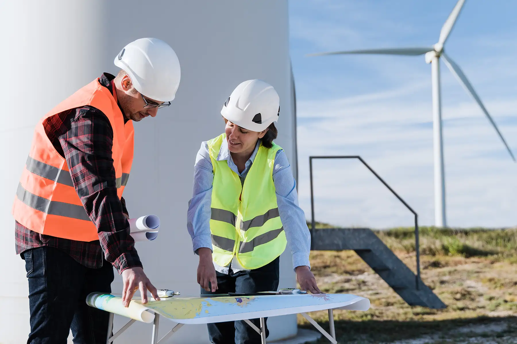 Engineers working at clean wind farm